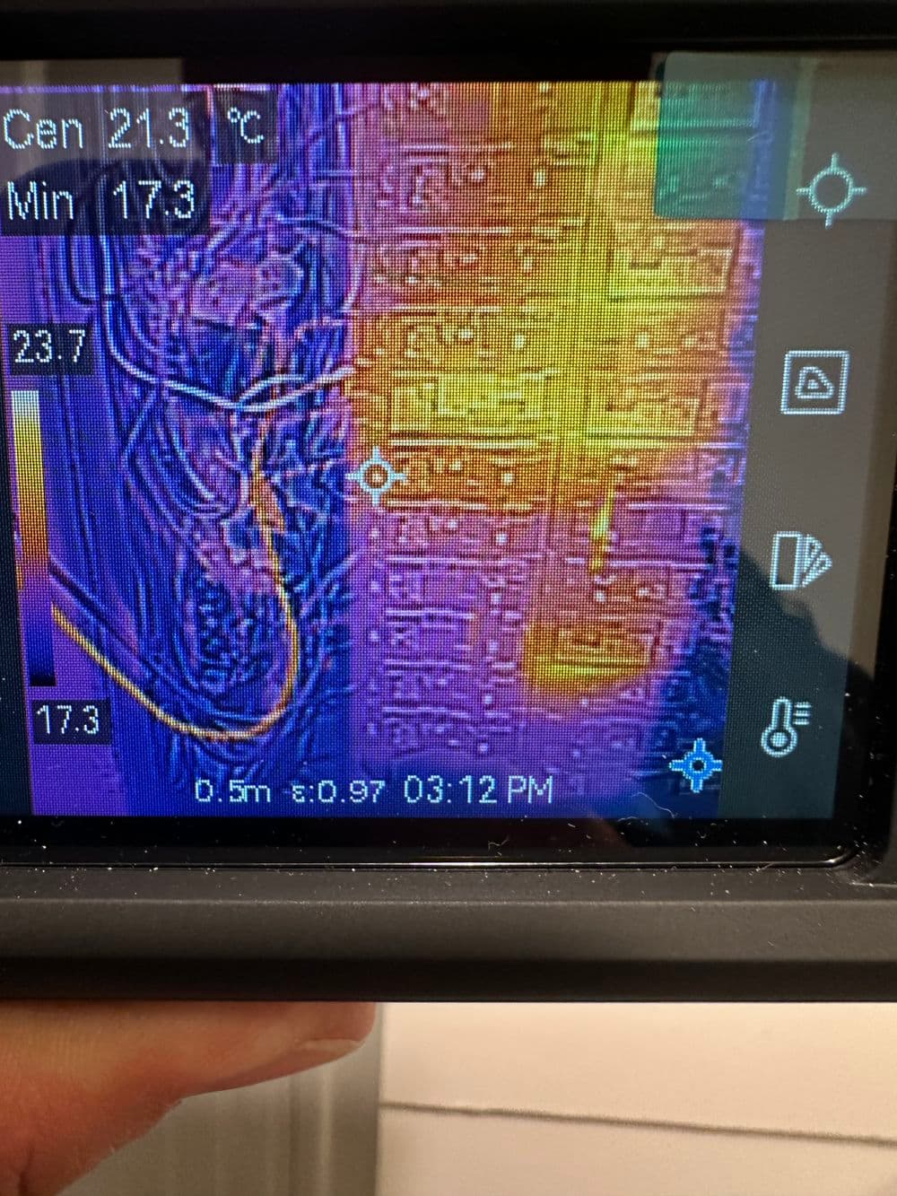 Thermal image display showing temperature readings and electrical connections with details.